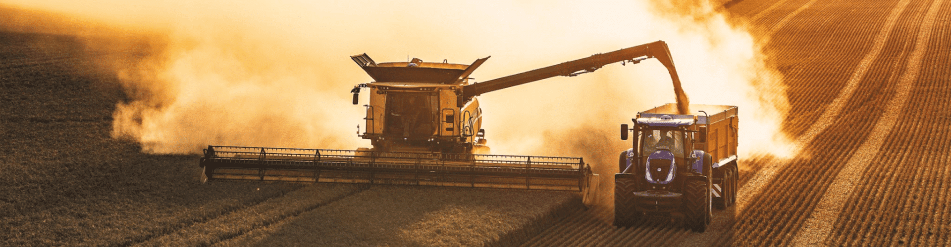 Harvester unloading into truck - Promo Page Banner